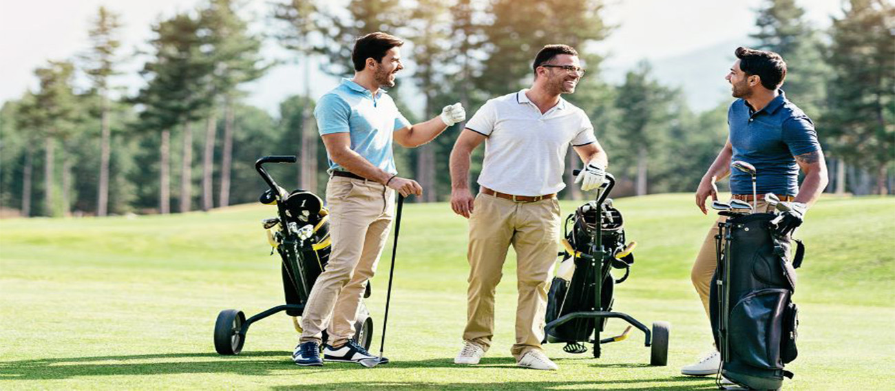 Three men talking while playing golf